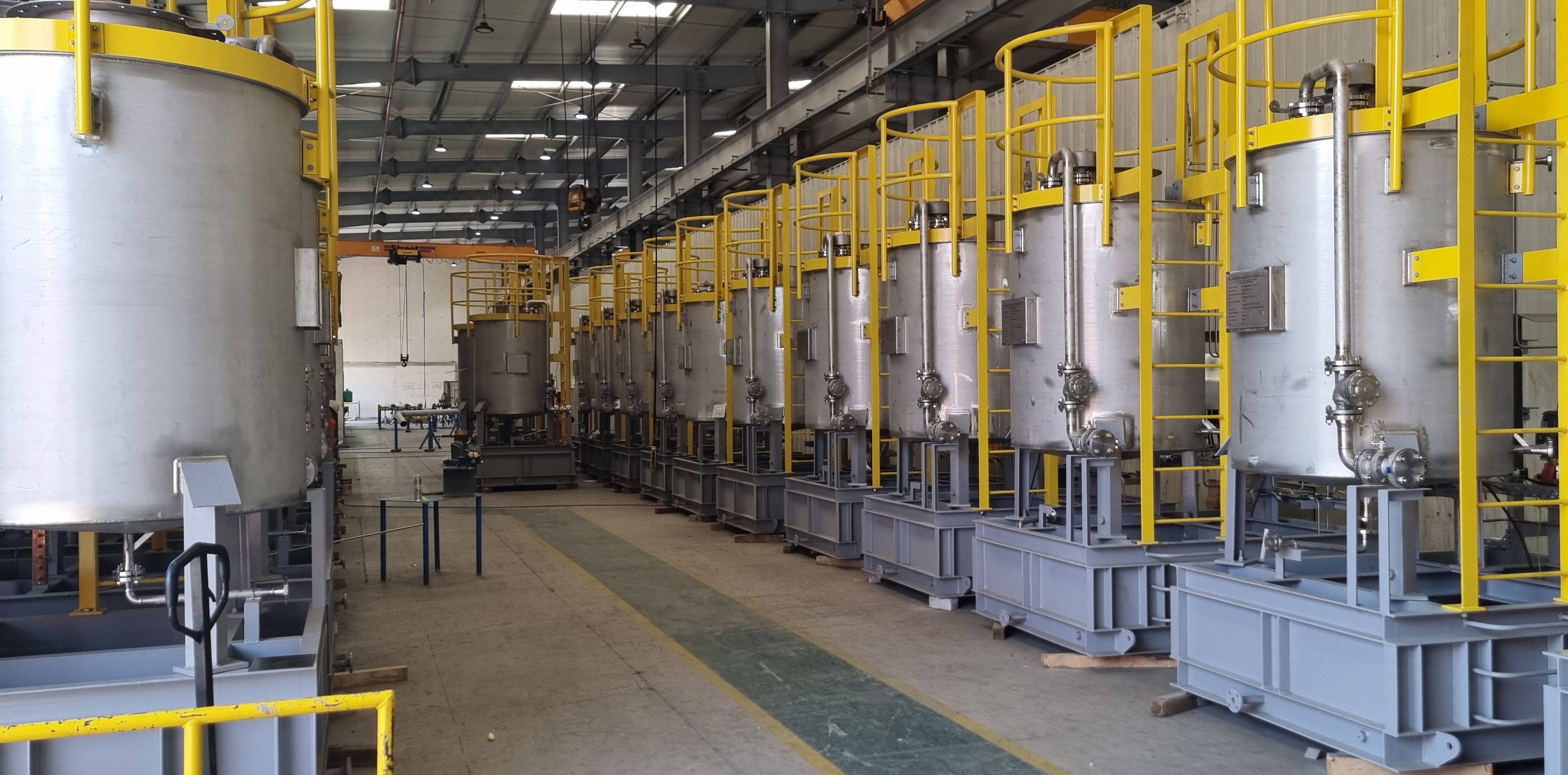 Row of stainless steel tanks in the Tema Gulf workshop