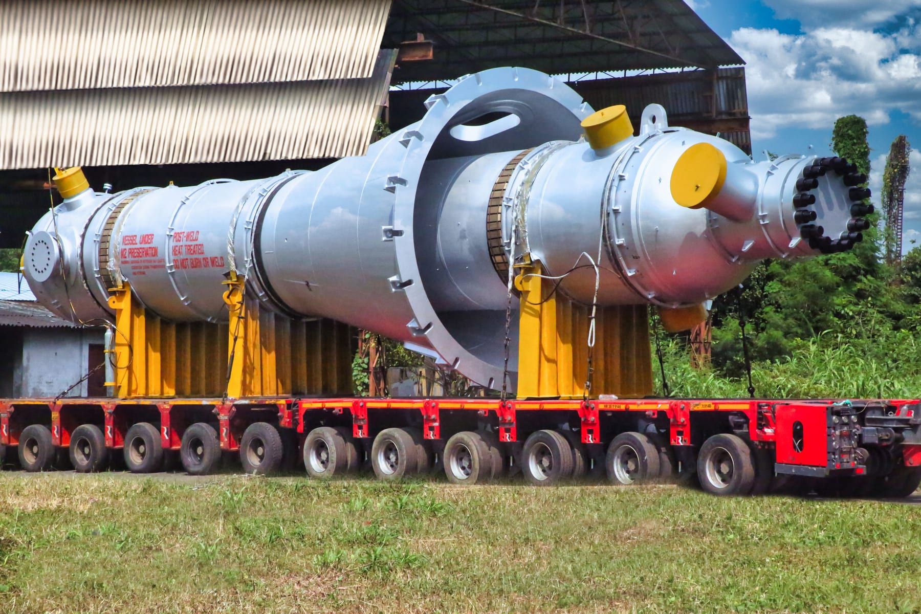 High pressure ammonia exchanger on a multi-axle hydraulic trailer