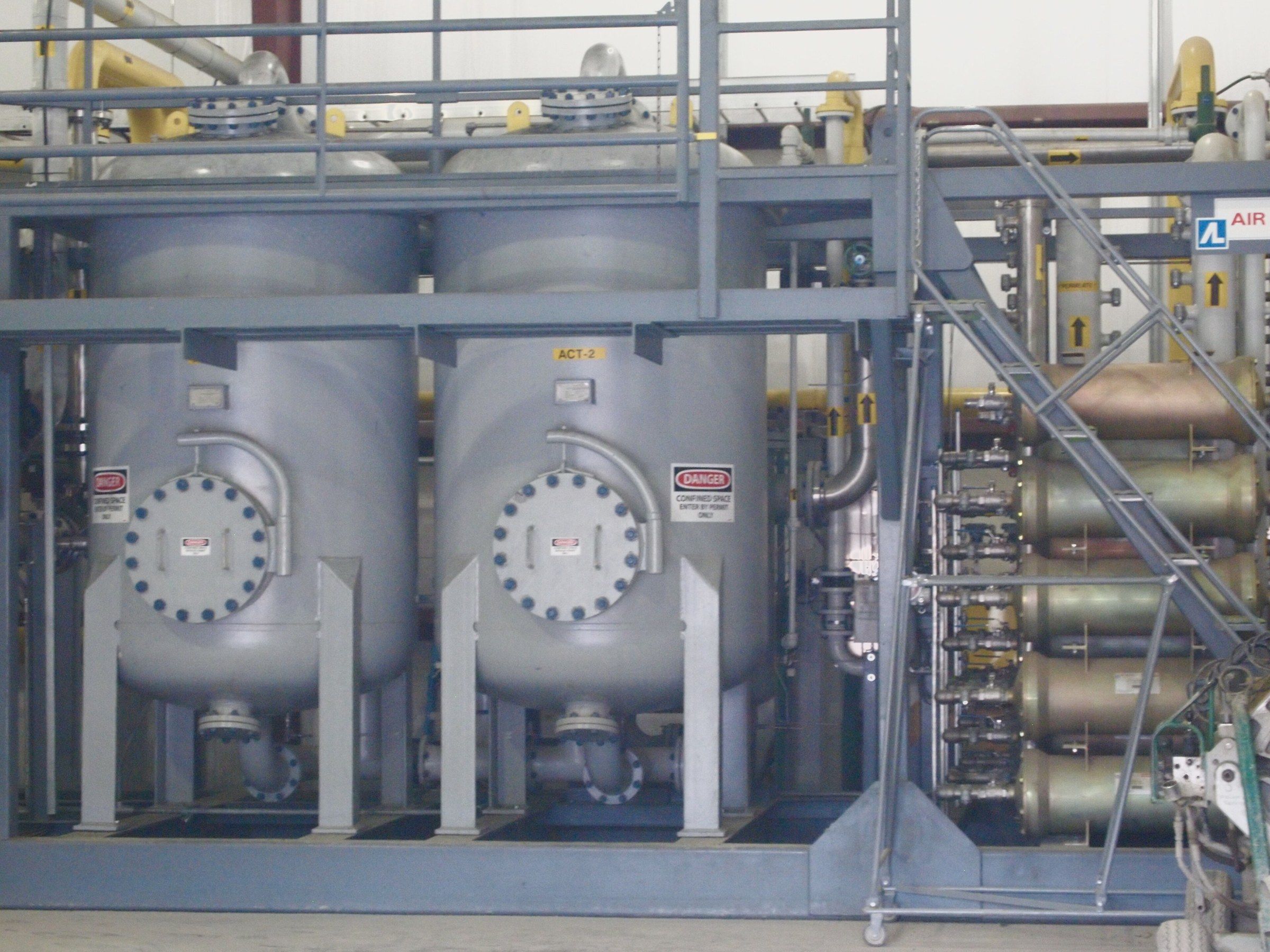 Gas separation skid with vessels, piping and valves on one frame